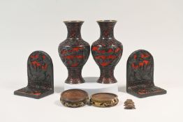 A pair of carved lacquer baluster vases with matching book ends Each well carved around the sides