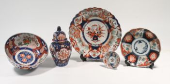 Two Japanese Imari plates, Meiji period (1868-1912), together with an Imari bowl, a small saucer and