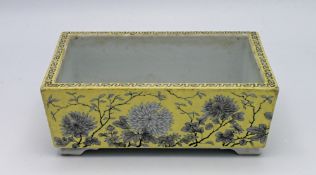 A grisaille decorated, yellow ground Dowager Empress pattern jardiniere, 19th/20th century, of