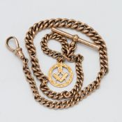 A 9ct rose gold albert chain with a 9ct gold masonic pendant attached, total weight approx. 31.9g
