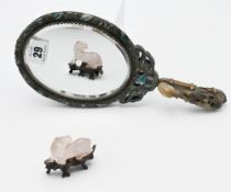 A carved jade belt hook, Qing dynasty, carved in the form of a horse’s head facing bats on a