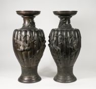 A pair of large bronze vases, Meiji period. Each of baluster from with the lobed ovoid body cast