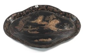 An English Papier-mâché lacquer tray, 19th century of lobed quatrefoil form, decorated in black
