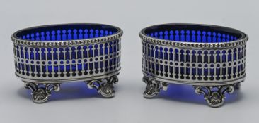Pair of large plated table salts with pierced on curl feet, length 9cm, height 5cm each with