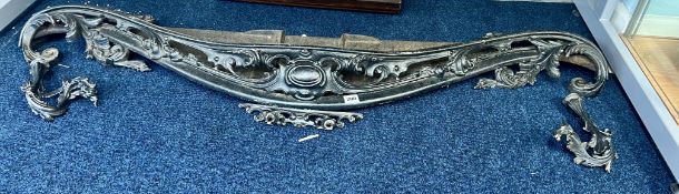 A large antique fire grate with detachable uprights of ornate scroll work, width approx. 135cm