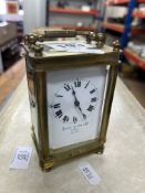 A Swiss miniature Favre Leuba Bombay carriage clock with platform escapement, lacks one bun foot.