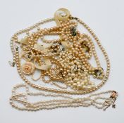 A two string pearl necklace set with a 9ct gold clasp together with other mixed pearls.