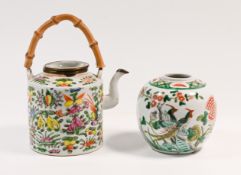 A Canton ‘famille-rose’ teapot and cover, of cylindrical form decorated overall with exotic birds