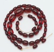 A set of cherry? amber bead necklace, approx. 95.6g (string broken).