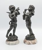 A pair of bronze winged cherubs musicians on marble base, height 34cm