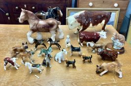 A collection of china wares to include Beswick dogs, large Sylvac cow, Beswick Horses etc.