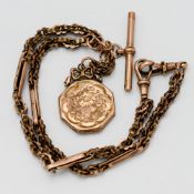 A fancy 9ct gold albert chain with a 9ct gold portrait pendant, total weight approx. 21.9g