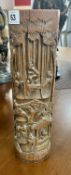 A tall bamboo brush pot with ornate carving to exterior, height 36cm.