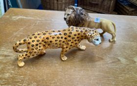 A large Beswick leopard, length 32cm together with a Beswick Lion (2)