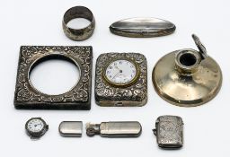 Silver capstan inkwell, silver napkin ring, silver cased travel clock, silver vesta, wristwatch