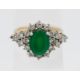 An 18ct yellow gold diamond and emerald cluster ring, size N. - Image 1 of 2