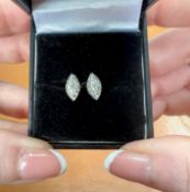 A pair of 18ct white gold and diamond set earrings of marquise setting.