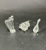 Swarovski Crystal Glass, three musical instruments, including a grand piano, a lute with stand and a