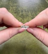 An 18ct yellow gold and platinum five stone diamond ring, size L.