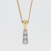 An 18ct gold three stone diamond pendant and chain.