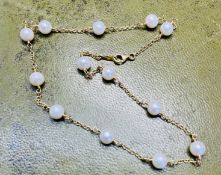 An 18ct natural pearl set necklace, approx. 8.80g,