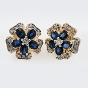 A pair of 14ct diamond and sapphire 'flower' style studs.