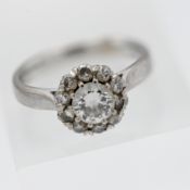 An 18ct white gold diamond cluster ring, size K.