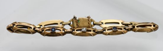 A gold diamond and sapphire bracelet, approx 21.10g.