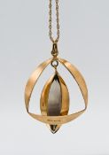A 9ct gold pendant with dark coloured stone on chain, in J.W.Benson box, approx weight 9.69g