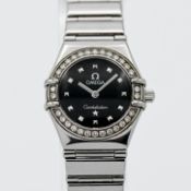 Omega, a ladies steel Constellation black dial and diamond set bezel, quartz movement, model