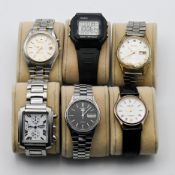 A collection of six wristwatches including three Seiko's, Casio, Avia, Amadeus in watch display