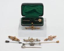 A collection of brooches and pins to include four 9ct gold approx 5.5g together with other