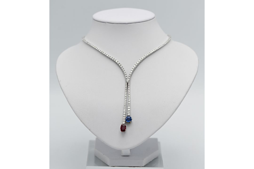 A stunning diamond line necklace set in 18ct white gold, further set with a large single ruby and - Image 1 of 2