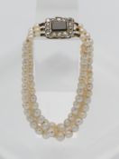 Three row pearl bracelet, clasp set with diamond and sapphire, length 19cm.