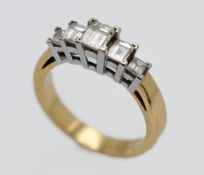 An 18ct Diamond Millenium ring, with stepped mount. Diamond weight 1.10 carat, finger size N,