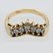 A 14k yellow gold 'V' shape diamond ring, size N