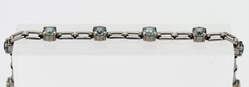 A 9ct white gold and blue zircon bracelet, length 18cm.
