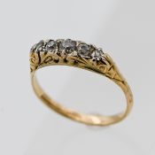 An 18ct yellow gold five stone carved head diamond ring, size P