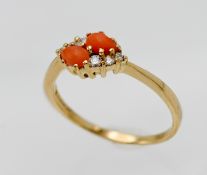 An 18ct yellow gold coral and diamond ring, size P/Q