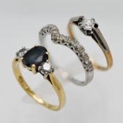 Three 18ct gold gem set rings, approx 7.8g.