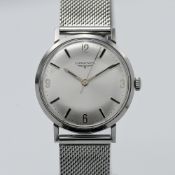 Longines, a gents manual wind wristwatch, on stainless steel strap.
