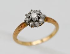 An 18ct yellow gold diamond cluster ring, size L.