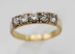 An 18ct ring set in yellow gold with five diamonds, size M.