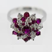 An 18ct white gold fancy ruby and diamond cluster ring, ruby and diamond set in a radiating pattern,