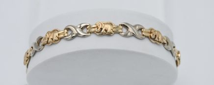 A yellow and white gold elephant and criss cross pattern bracelet, probably 14k gold, weight 22.