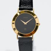 Gucci, a gents quartz wristwatch with black dial, back plate number 3000 M, 0016385 on black leather