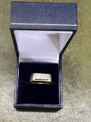 An 18ct yellow gents ring set with ten diamonds, size R/S, total weight 7.68g