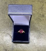An 18ct yellow gold and synthetic ruby dress ring, size O.