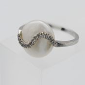 An 18k white gold and YVIL Mabe diamond and pearl ring, of abstract design, size L