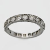 A platinum set diamond full eternity ring mixed of old brilliant cut diamonds in stud claw